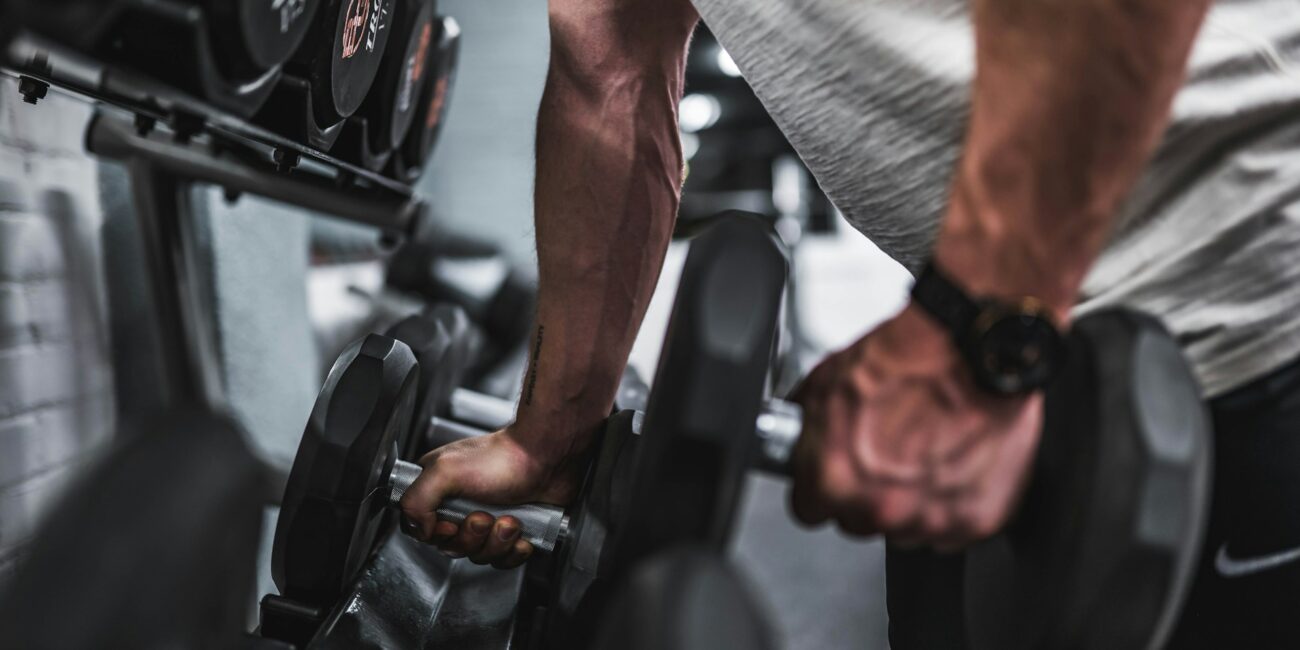 man lifting weights